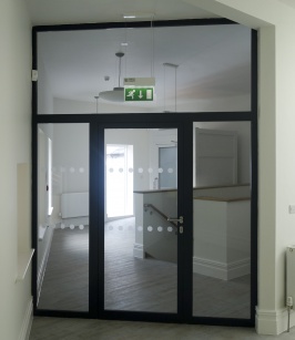 Powder coated fire rated single door with side and transom panels